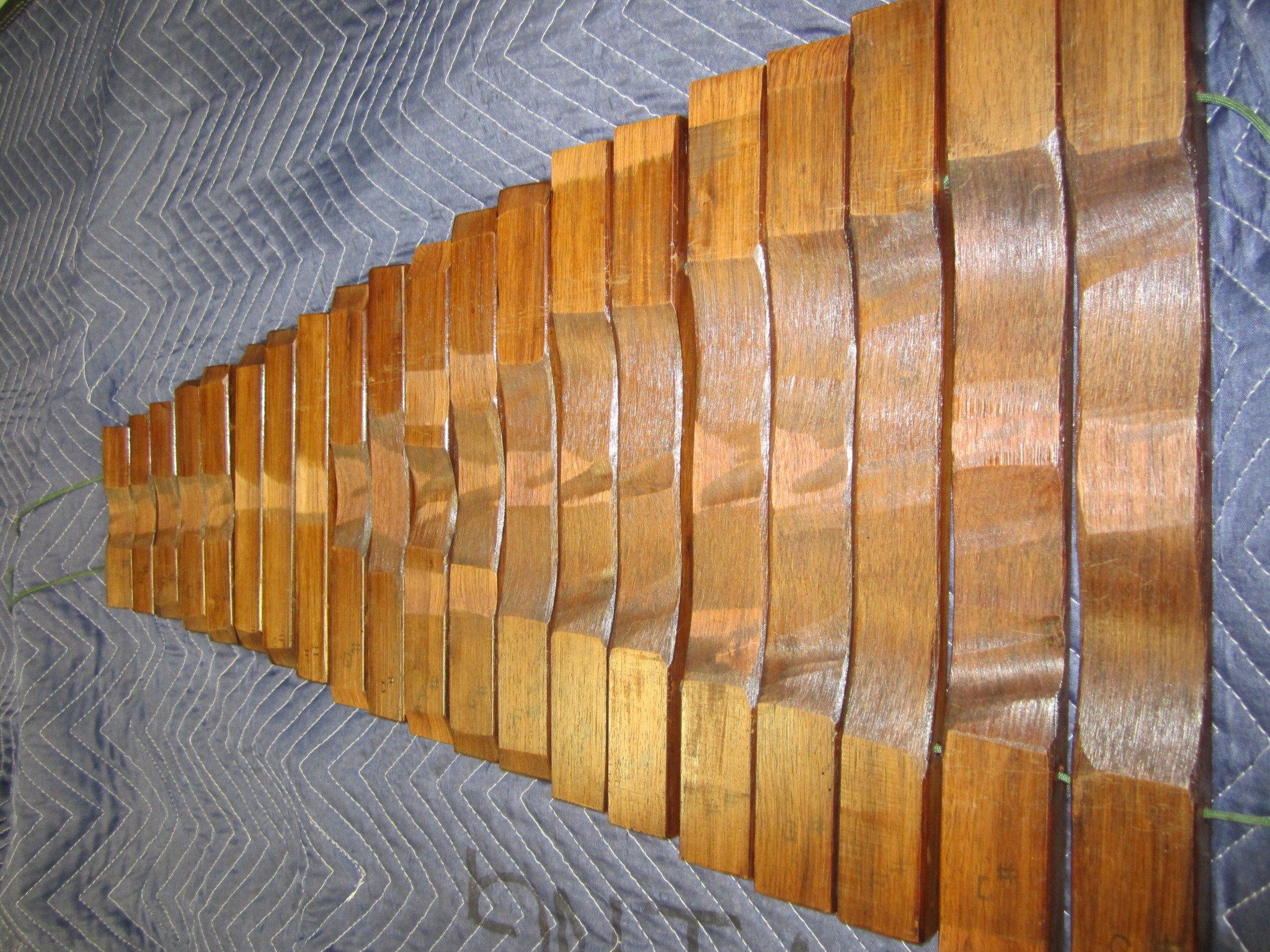 Shaped underside of some of the bars for a Kori Model 310 xylophone.